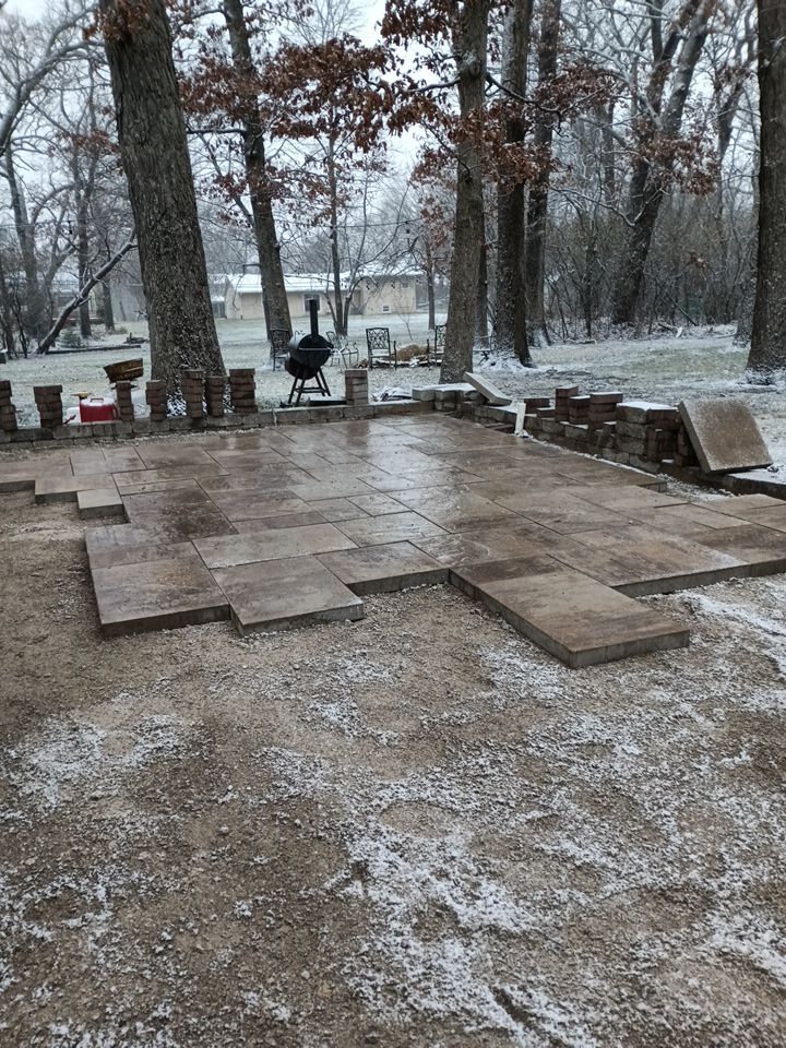 Paver patio and wall under construction